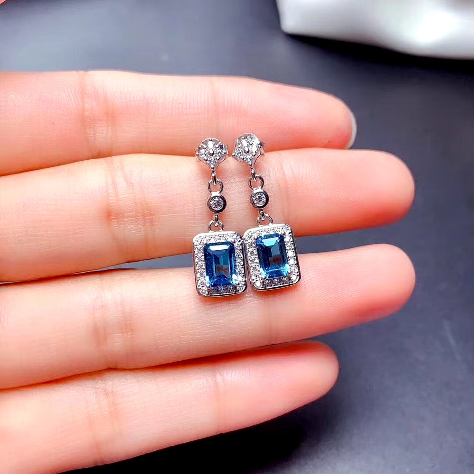 London Blue Topaz Emerald Cut Dangle Earrings, London Blue Topaz Jewelry, London Blue Topaz Cluster Stud Earrings, Women's London Blue Topaz Earrings, London Blue Topaz Jewelry, Natural London Blue Topaz Gemstone Jewelry Set, Women's London Blue Topaz Earrings, London Blue Topaz Ring, London Blue Topaz Stud Earrings, London Blue Topaz Earrings, Women's London Blue Topaz Jewelry, Sterling Silver London Blue Topaz Jewelry, December Birthstone London Blue Topaz, London Blue Topaz Spiritual Meaning