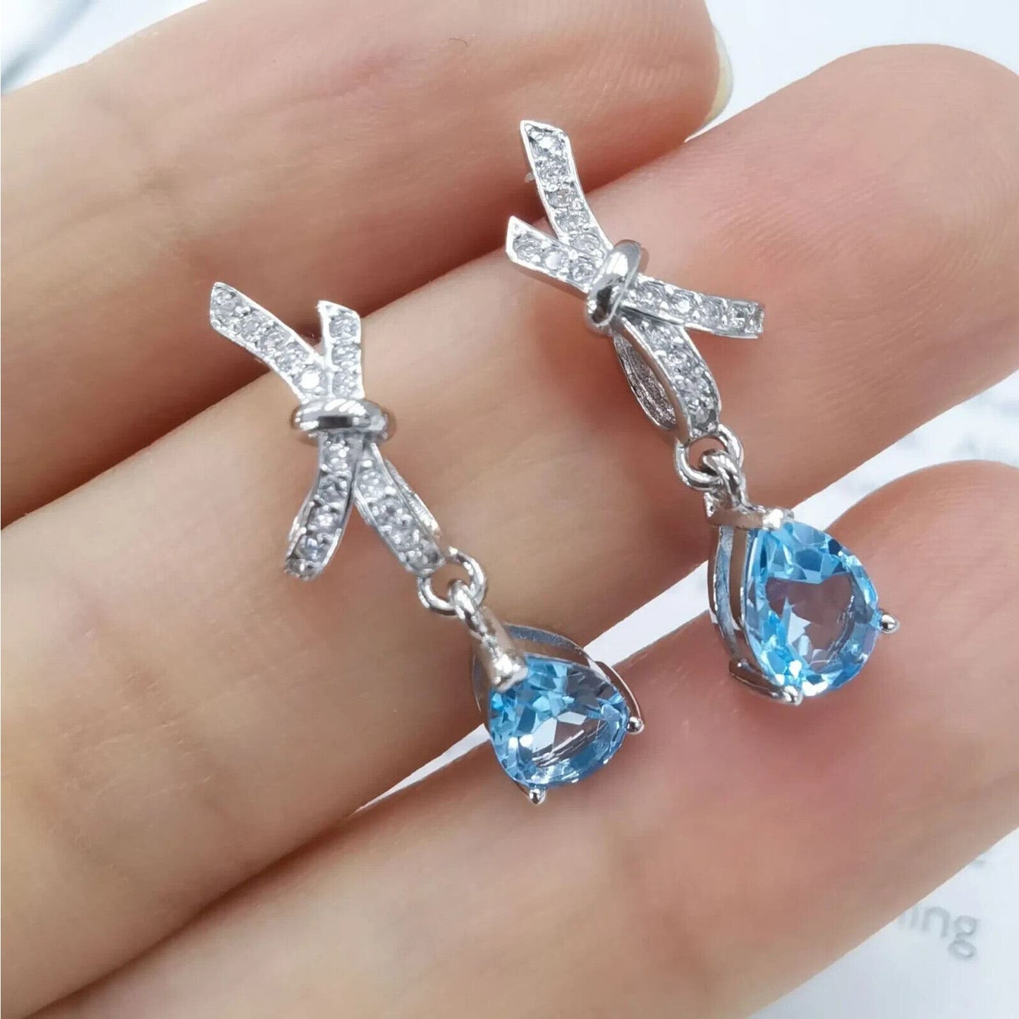 Swiss Blue Topaz Pear Cut Bow Tie Earrings 5x7mm